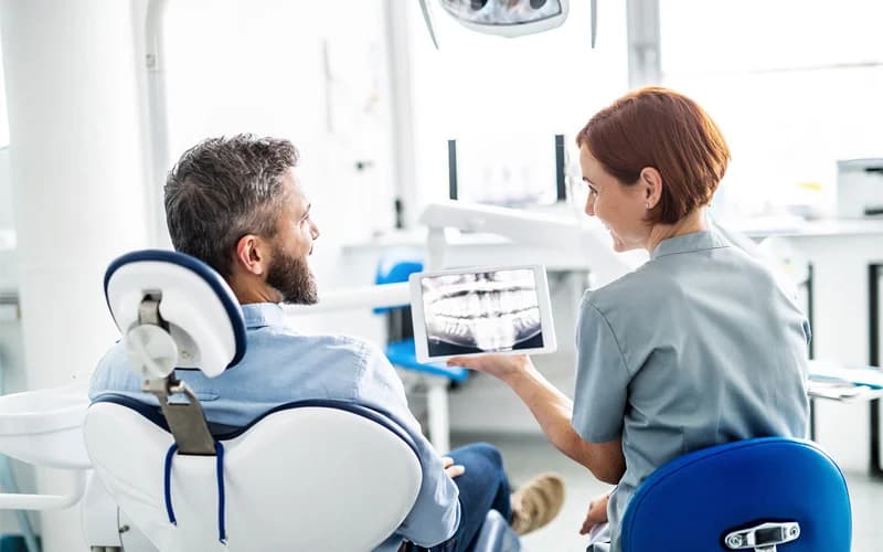 Dentist showing All on 6 treatment plan